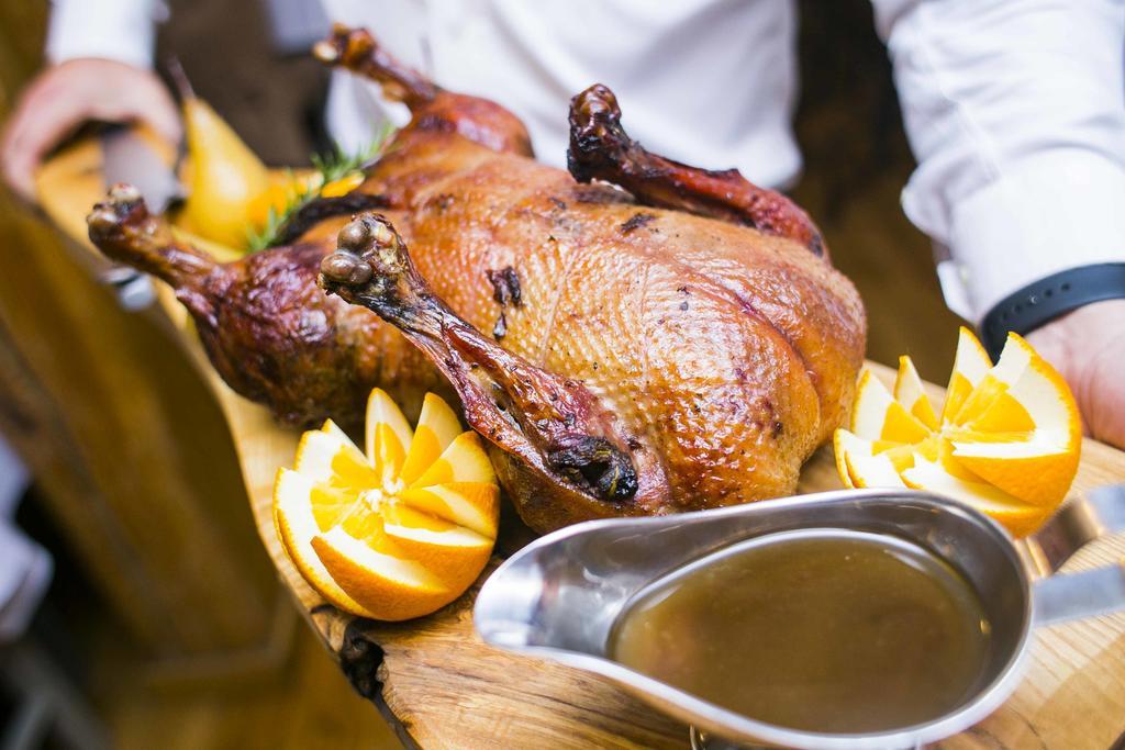 Hotel Gdansk Boutique Exterior photo A roast duck with orange sauce